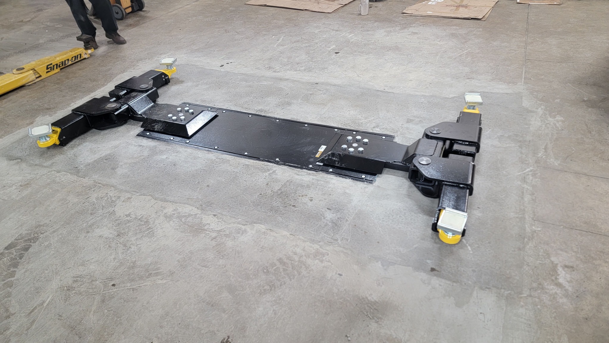 Completed inground lift installation in dealership bay