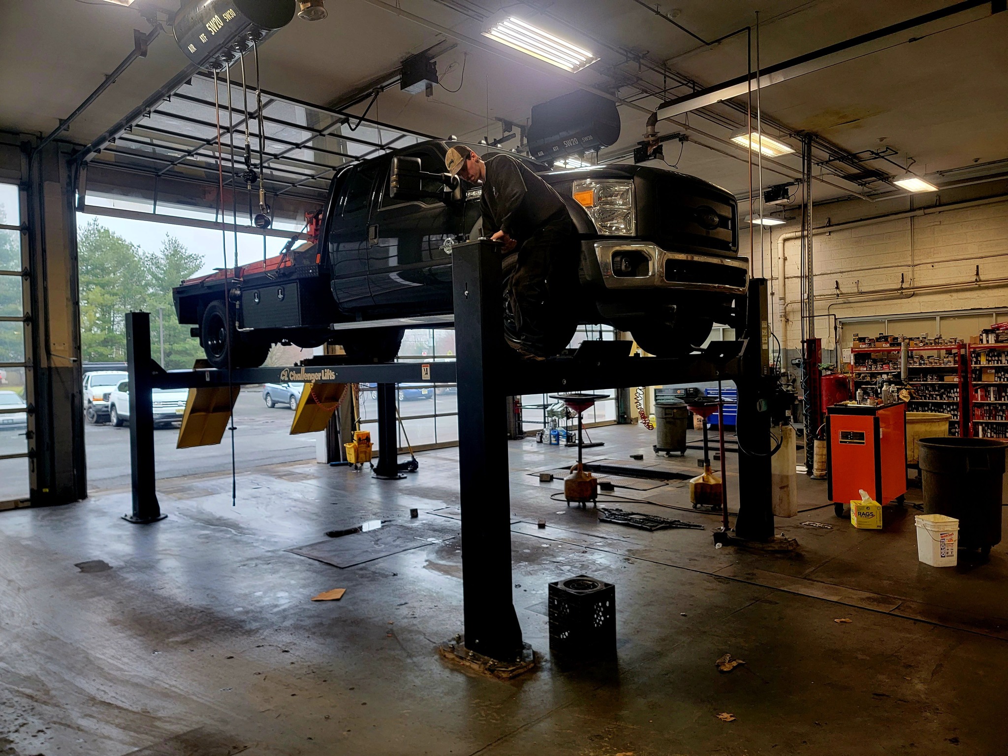 4-post service lift installed in commercial shop